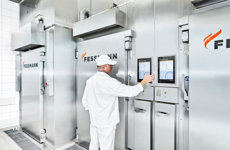 Fessmann smokehouse being attended by a technician 