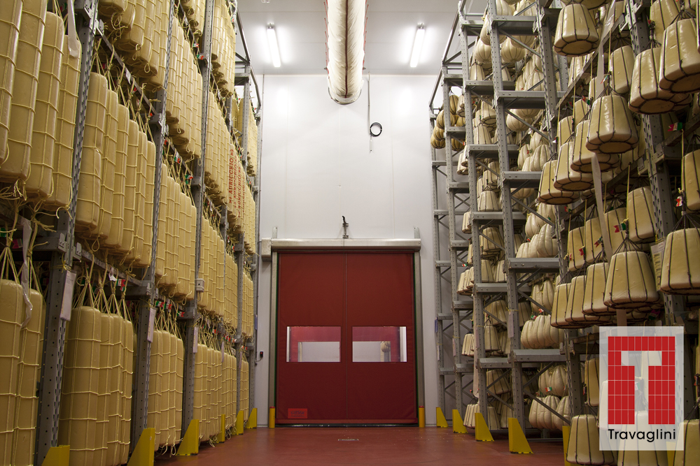 racks of cheese rolls in a Travaglini aging room